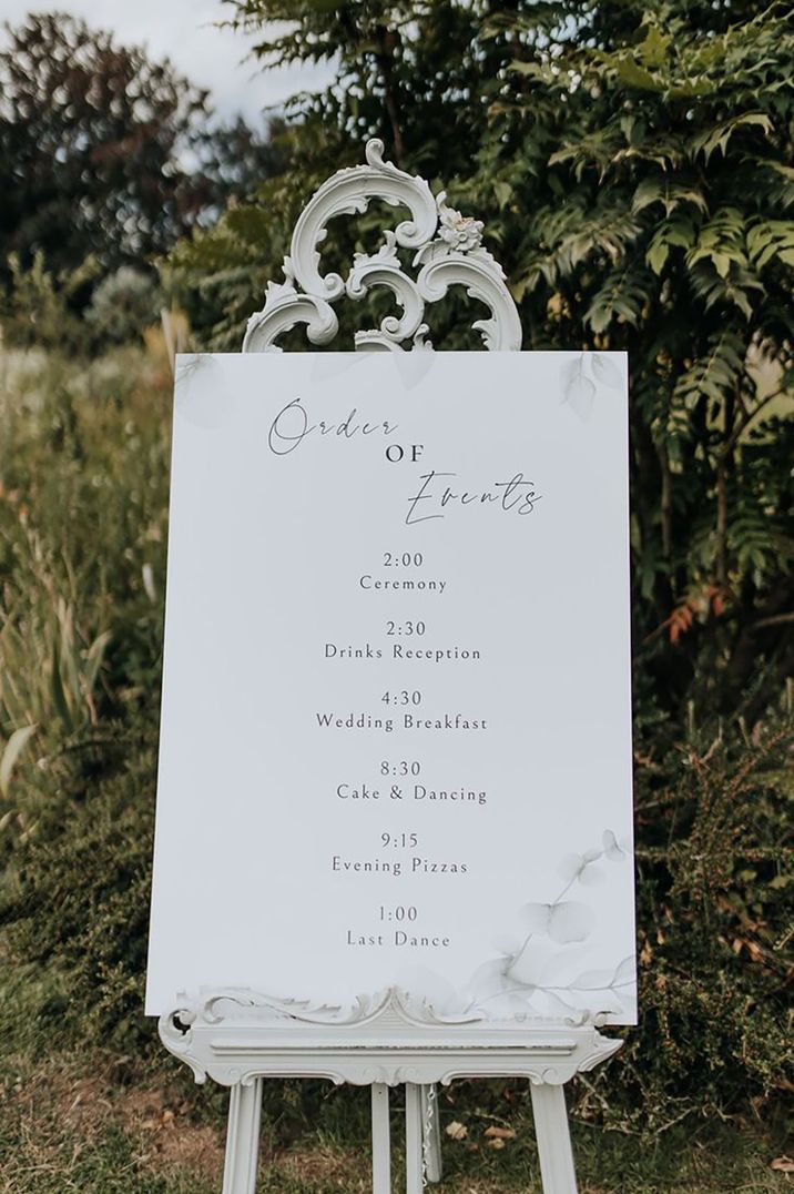 Traditional all white wedding order of the day sign 