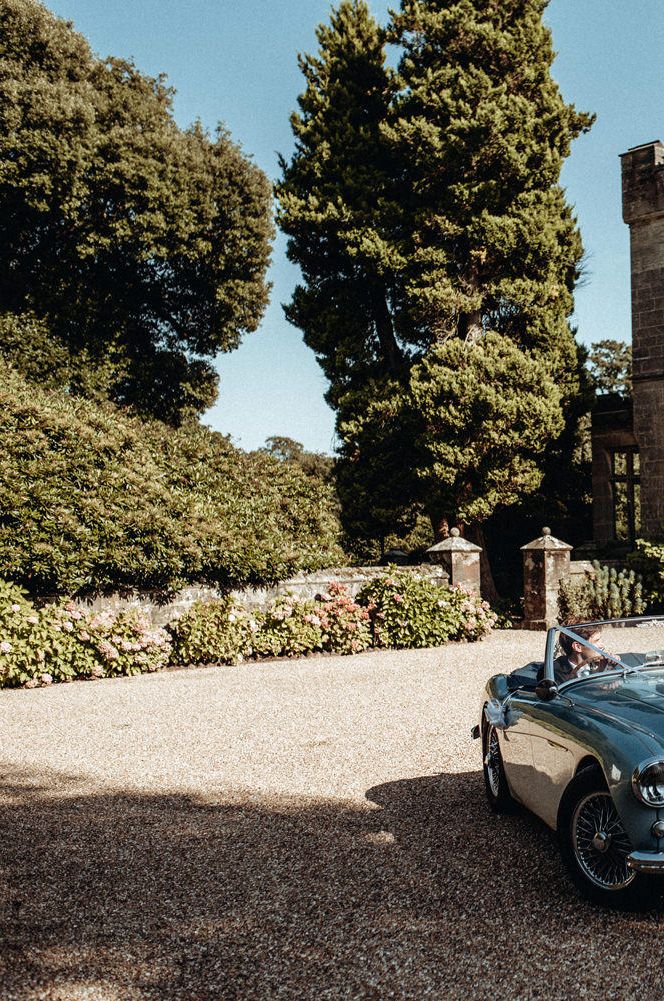 Bride and Groom in the Wedding Car outside their Castle Wedding Venue