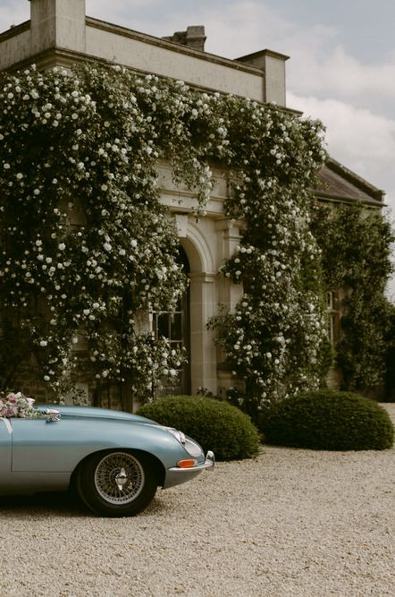 Blue Wedding Car on the Venue's Driveway