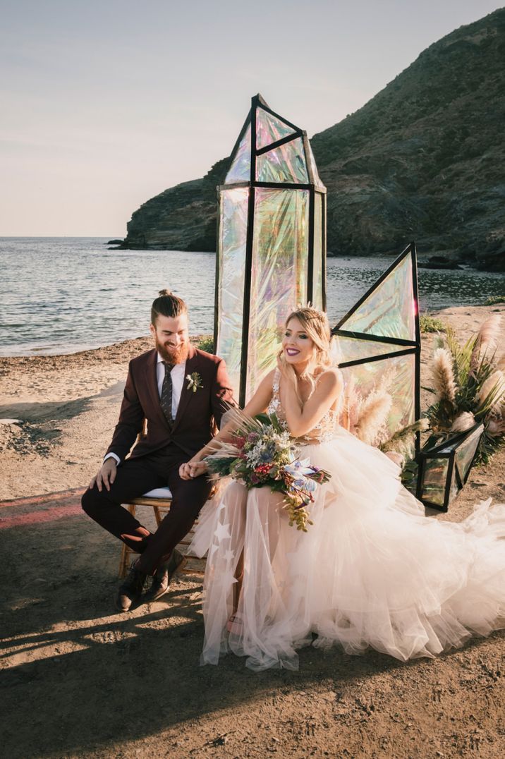 Festival bride and groom beach wedding ceremony