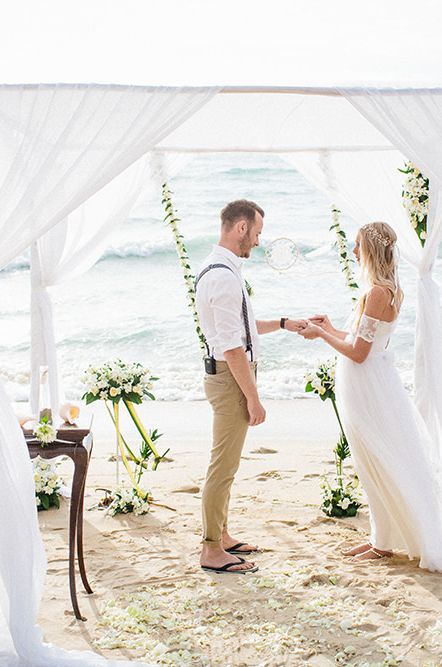 Beach weddings ceremony with draped altar