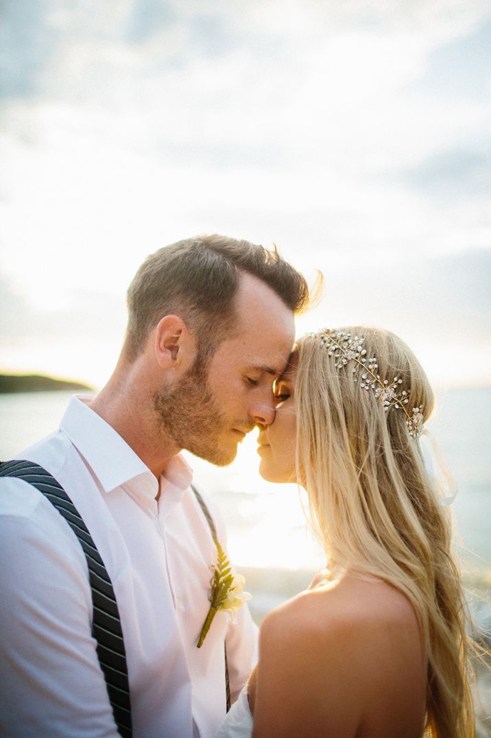 Intimate bride and groom sunset portrait for beach wedding