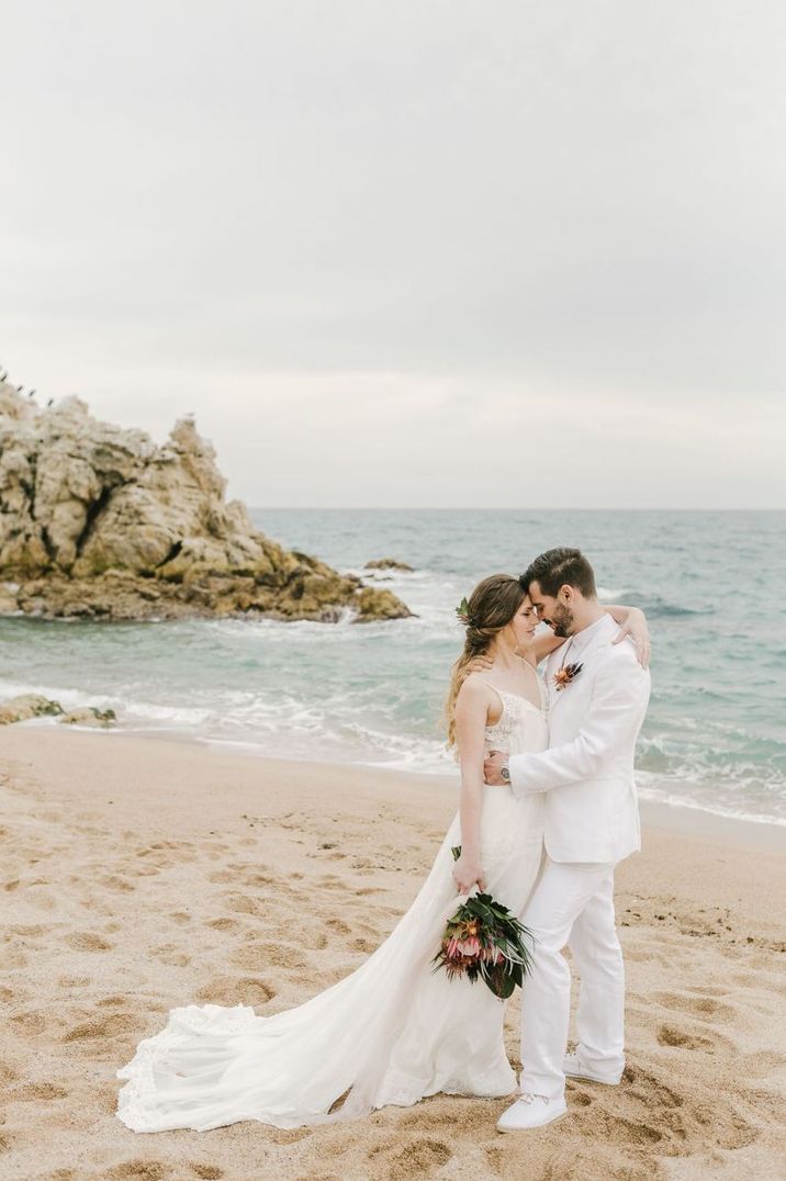 Bride and groom portrait on the beach