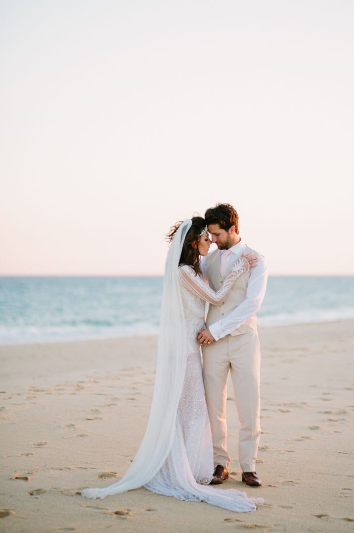 Intimate bride and groom portrait on the beach