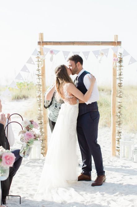 beach weddings ceremony with bunting decor