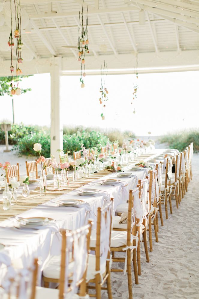 Beach weddings reception with hanging flowers