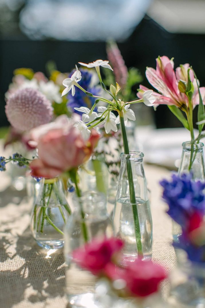 Wedding centrepiece created using blue hyacinths, white narcissi, pale pink roses and forget-me-nots