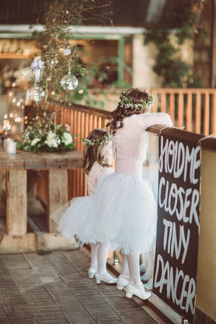 Flower girls in white tutus with blush pink jumpers