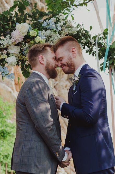 Gay wedding with emotional grooms during wedding ceremony