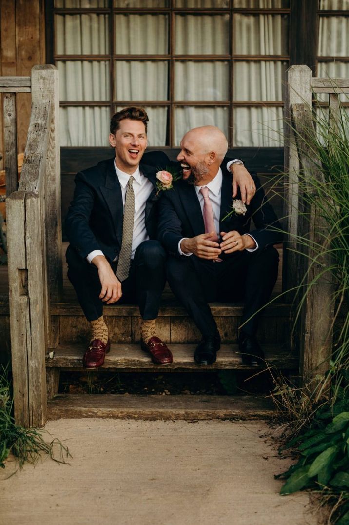 Gay wedding with grooms in navy suits