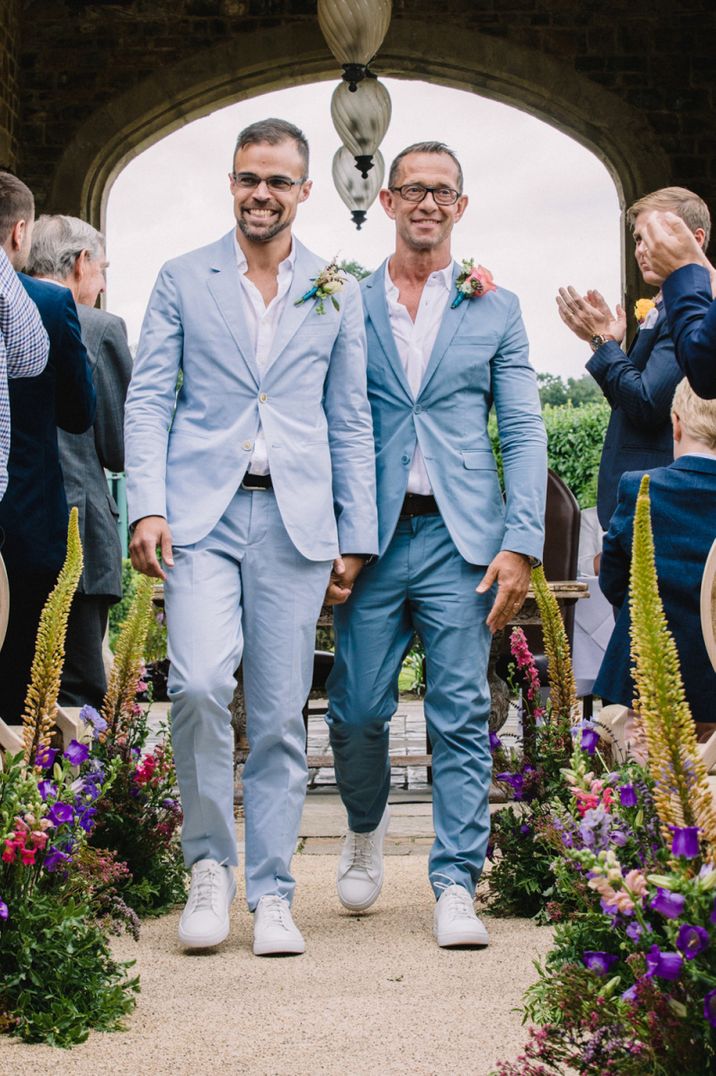 Gay wedding with grooms in light blue suits