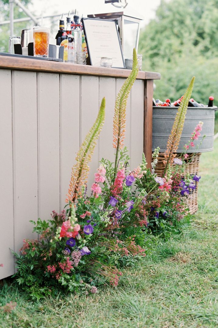 Wild wedding flowers decorating the bar