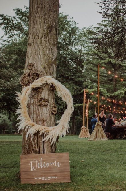 Pampas grass hoop decor and wooden wedding sign