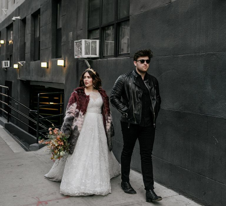 Bride & groom walk hand in hand