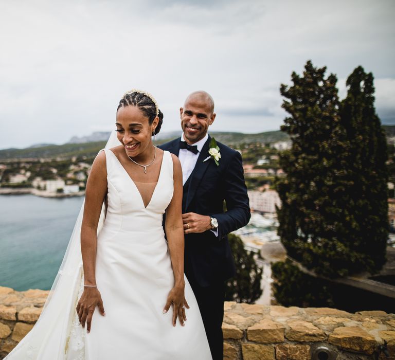 The bride and groom laughing at Chateau de Cassis