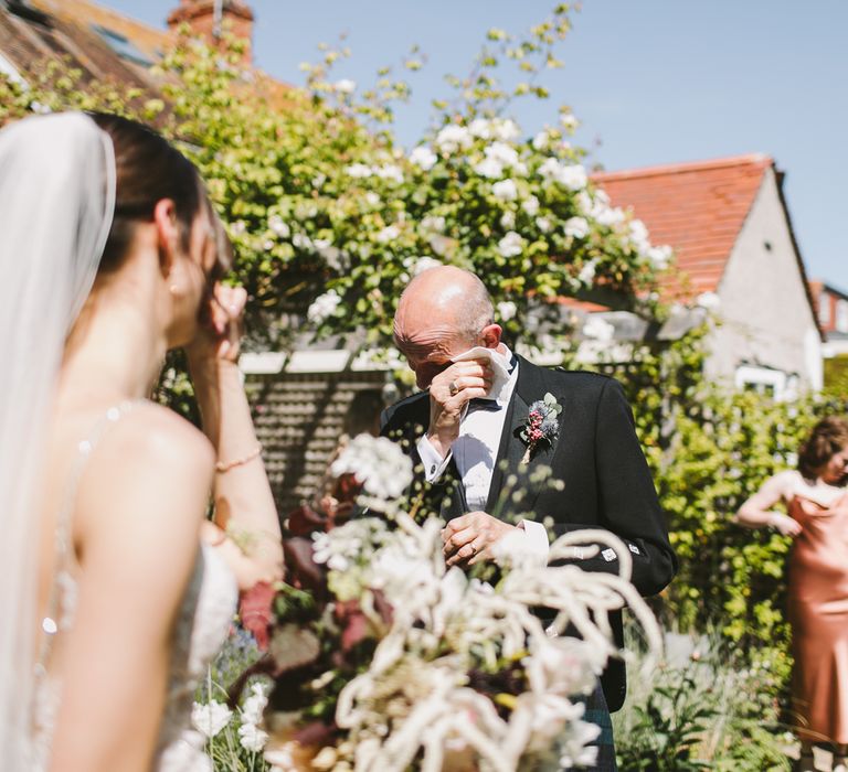 Father of the bride becomes emotional when seeing her