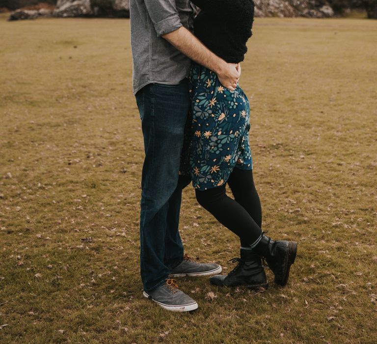 Couple embrace outdoors in the Dartmouth countryside 