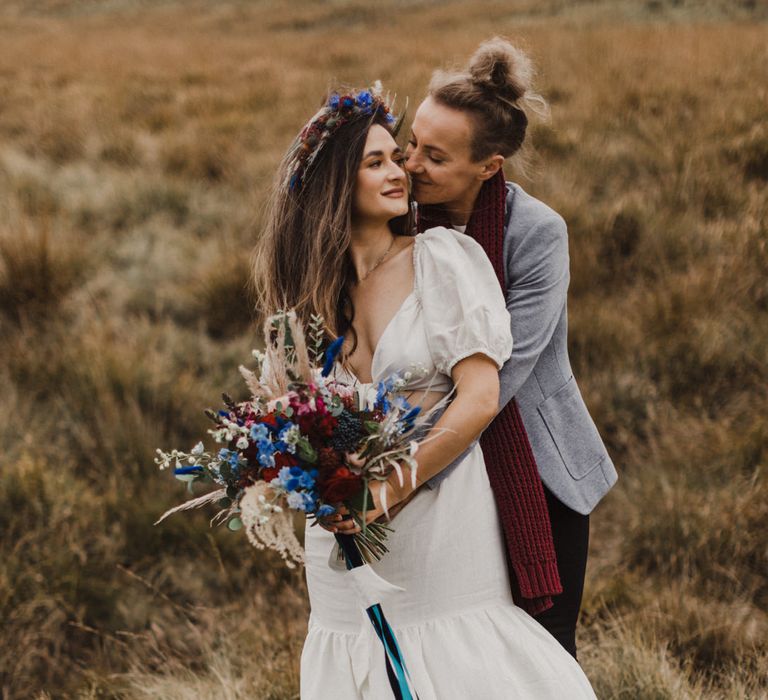 Two brides posing at their Peak District elopement ceremony