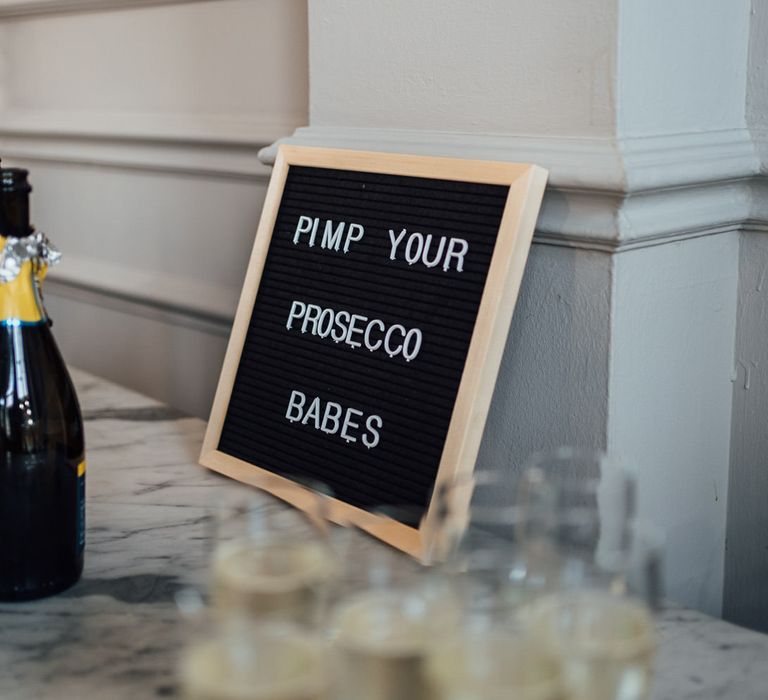 Personalised wedding sign with Prosecco bottles