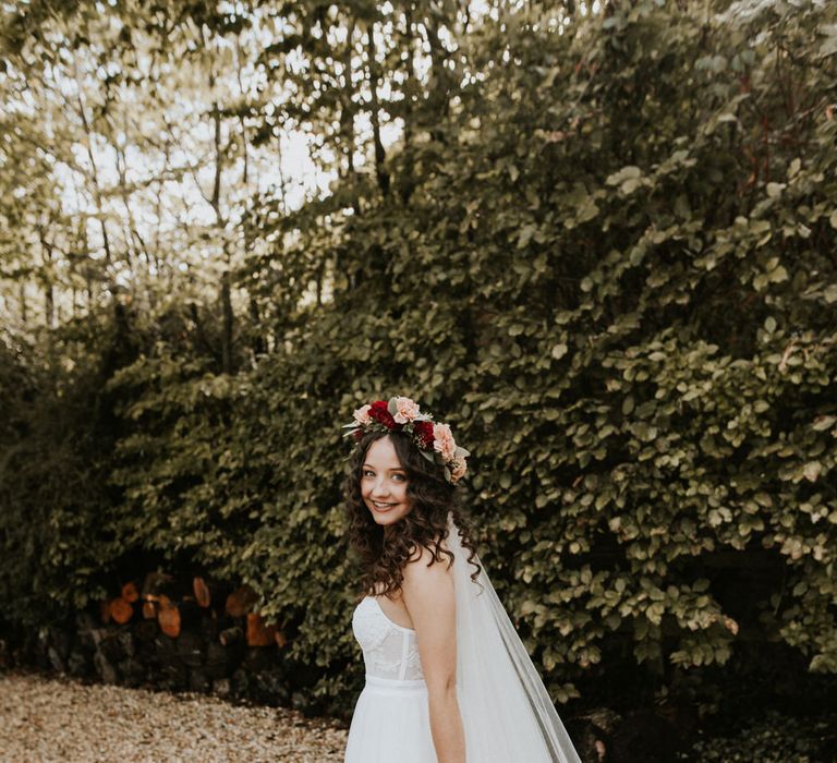 Boho bride in a tulle skirt wedding dress with spaghetti straps 