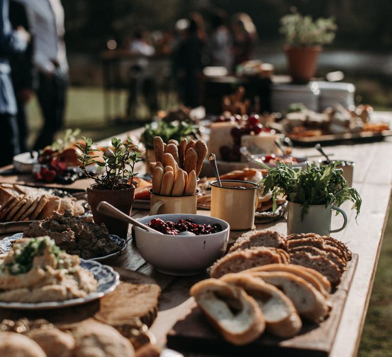 Grazing table of food for outdoor rustic wedding reception