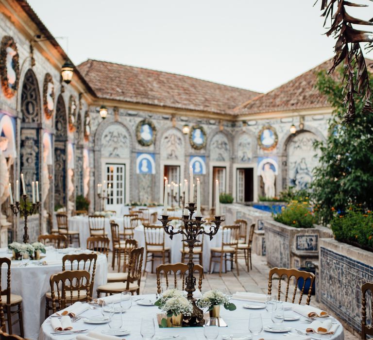 Outdoor wedding reception in Lisbon surrounded by colourful tiled buildings