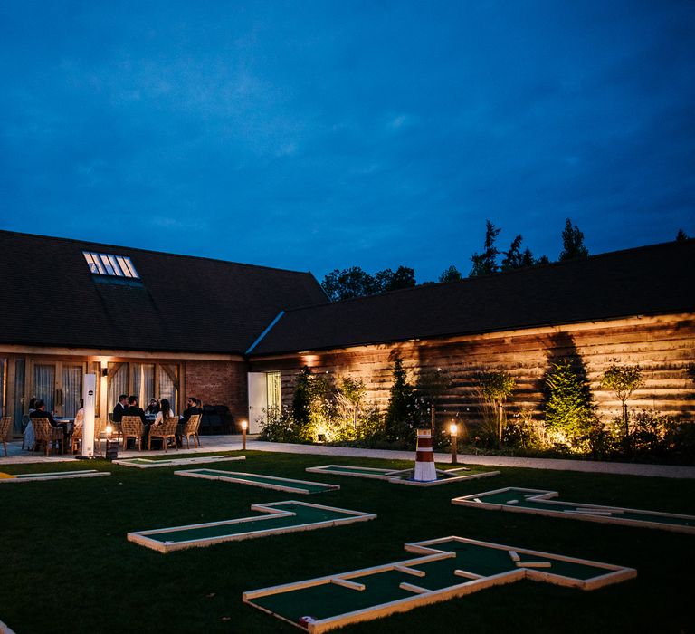 Barn lit up at night for wedding reception