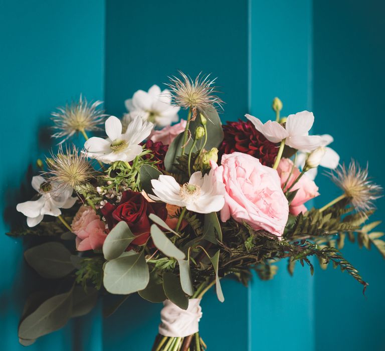 Red, pink, white and green wedding bouquet with dahlias, roses and foliage 