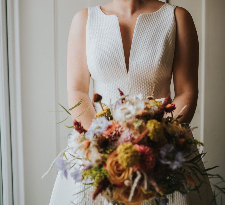 Bride wears star drop earrings and Jesus Peiro wedding dress