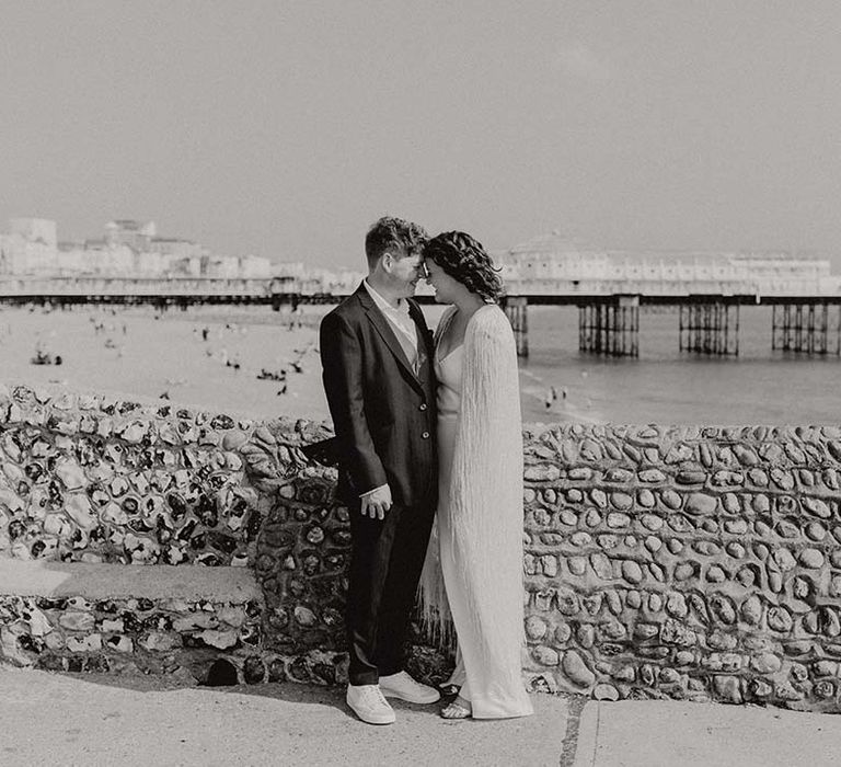 Black & white image of bride & groom near Brighton seafront