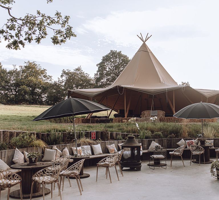 Outdoor wedding venue complete with tipi and fire pit