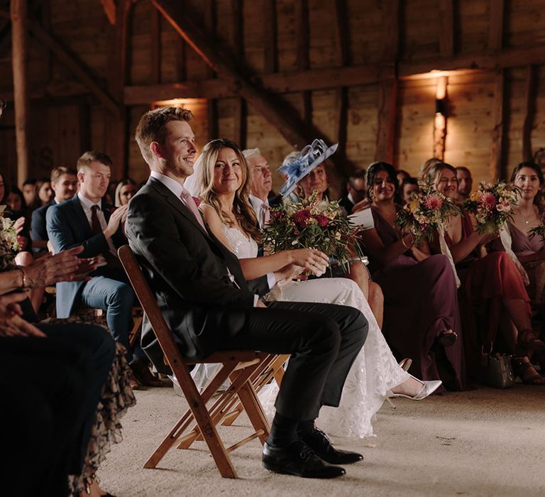 Bride and groom during rustic wedding ceremony at White Pond Farm