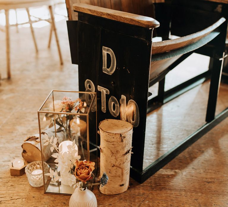 Old cinema style wedding chairs for industrial wedding ceremony with rustic aisle decor