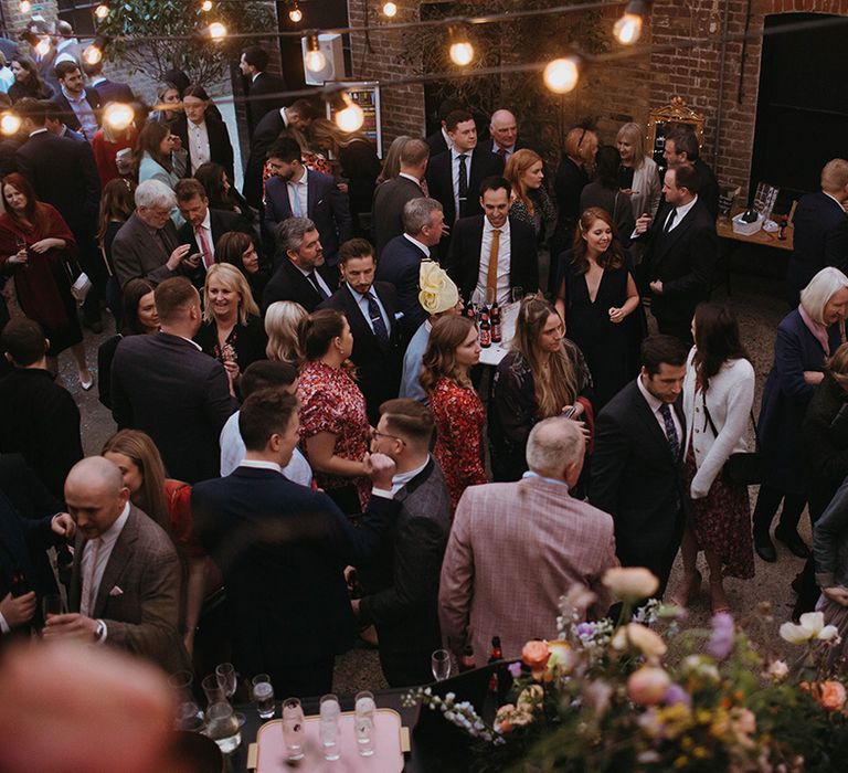 Wedding guests socialise outside at Loft Studios in London