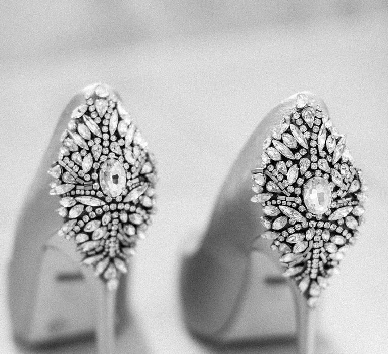 Silver wedding shoes with the heel covered in gems 