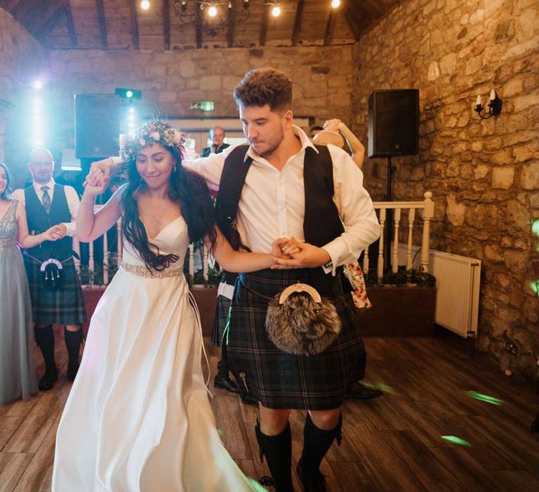 Bride and groom dancing at wedding party at The Barn at Harburn wedding venue 