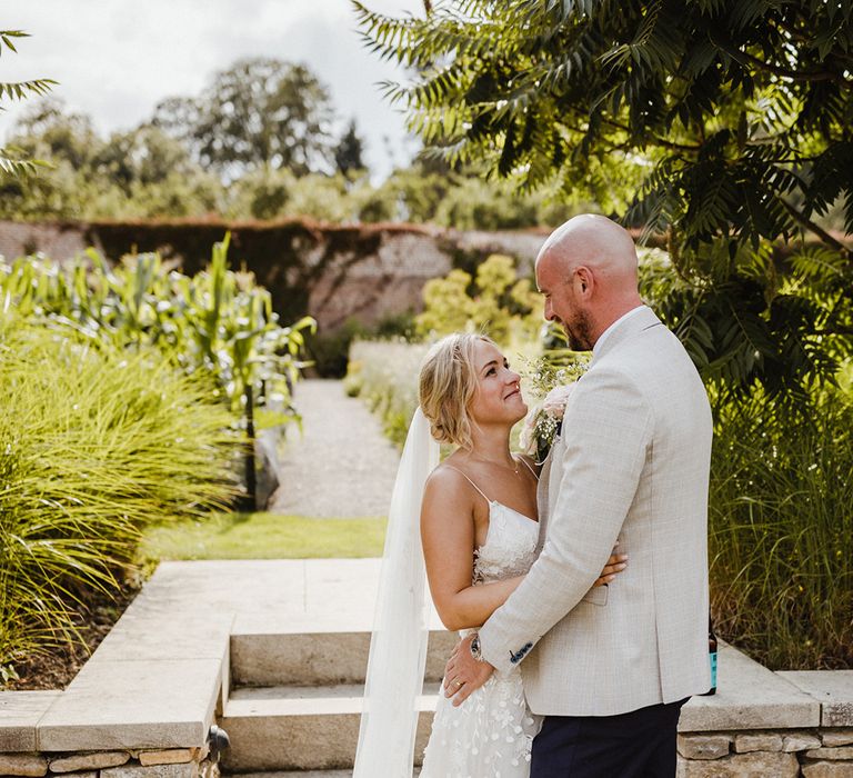 Cute couple portrait of the bride and groom as they spend a few moments together on their wedding day 