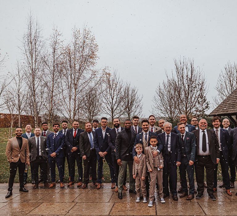 All of the men at the Stone Barn winter wedding in their smart and traditional suits