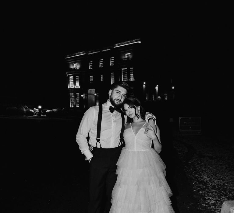 Stylish black and white wedding photo of the bride and groom at their Hedsor House winter wedding 