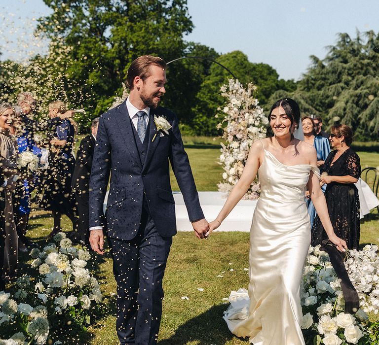 Confetti moment for the bride and groom at Offley Place wedding 