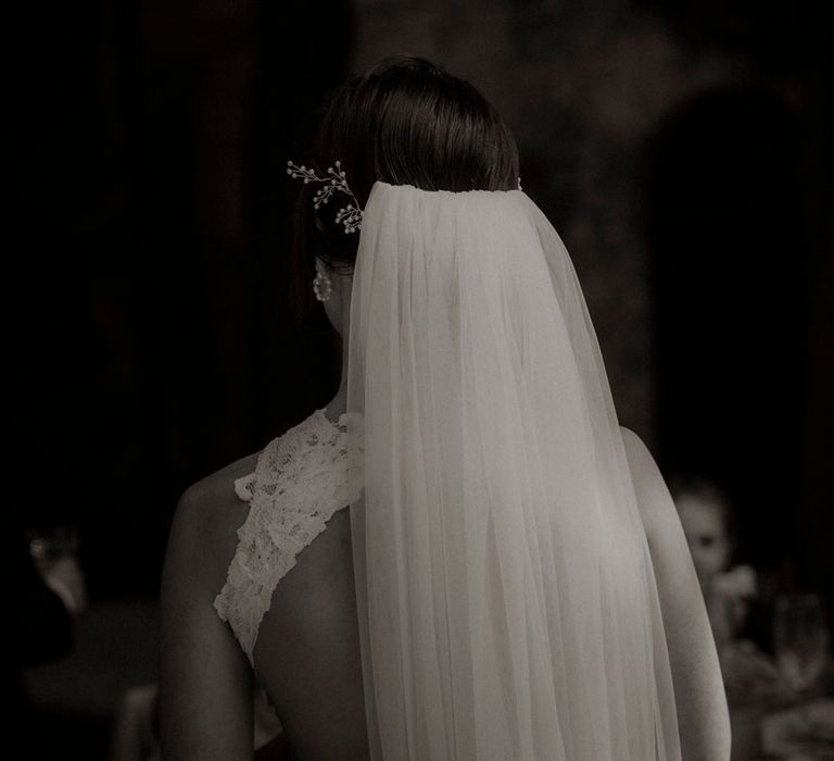 Bride wearing white veil for classic wedding in Italy 