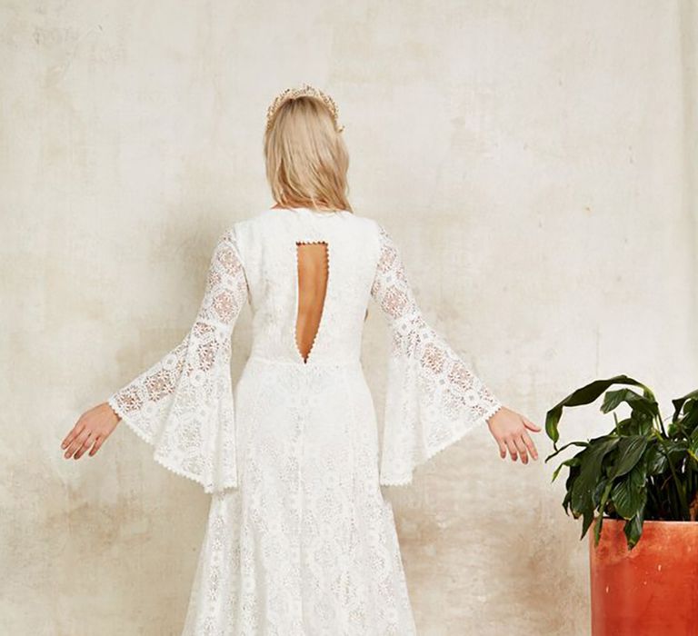 Sustainable 'Cassidy' wedding dress from Indiebride London in boho style with long bell sleeves and lace material