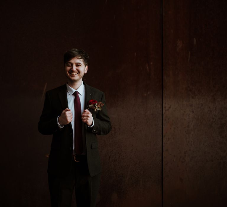 Groom in brown wedding suit for elopement