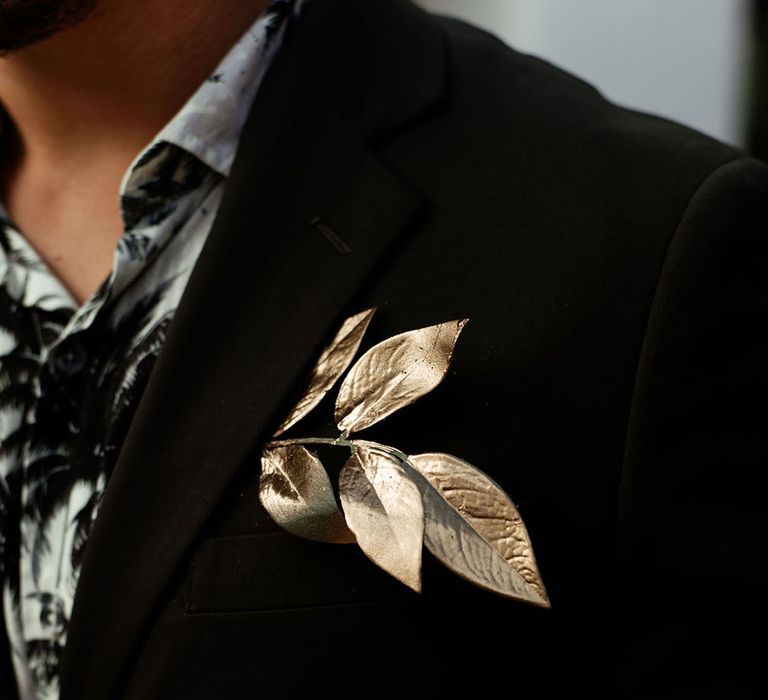 Gold buttonhole flower. Photography by Stephanie Shenton.