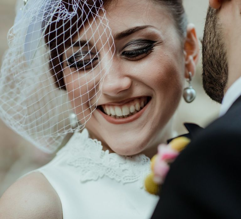 The bride went for a 1960s inspired makeup look with smoky winged eyeliner