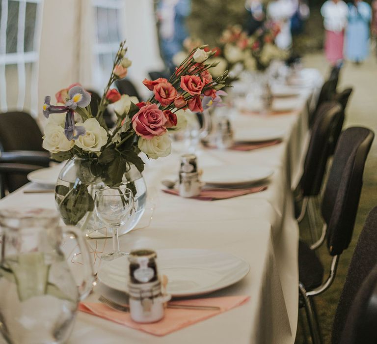 Flowers in fishbowls as wedding table centrepiece decor 