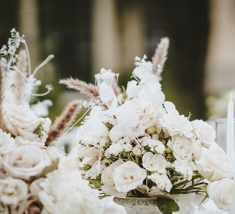 Beautiful white florals complete with green foliage and pampas grass