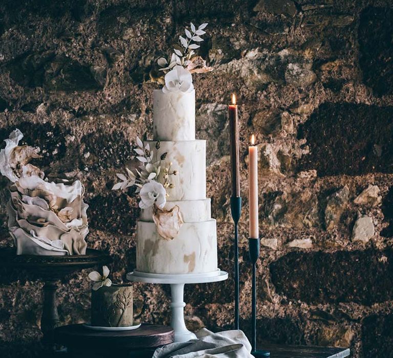 boho black tie wedding cake table with single tier and four tier wedding cake designs. 