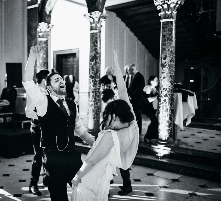 Bride & groom dance during their wedding reception 