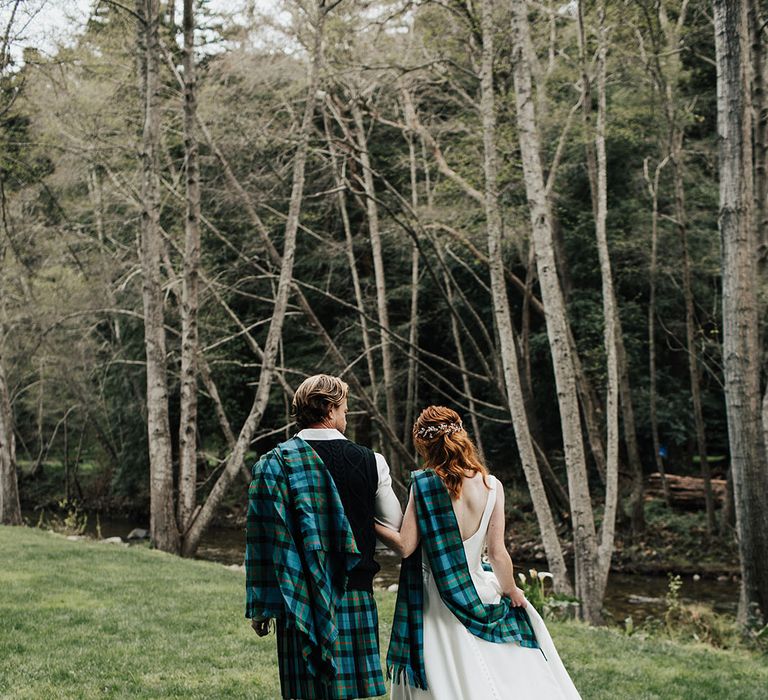 Scottish highland elopement in Big Sur with bride and groom wearing green and blue tartan 